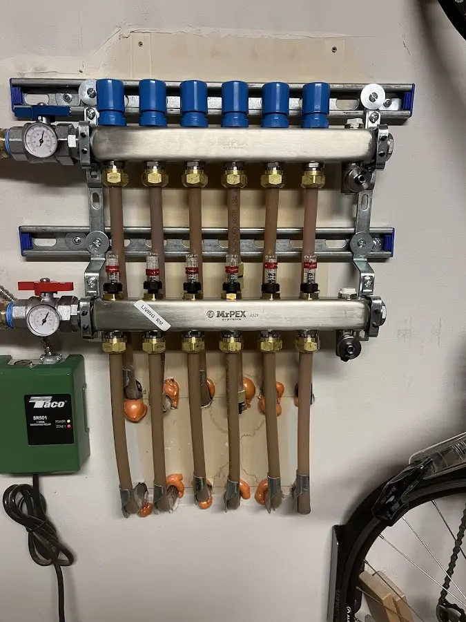 Plumber performing Water Heater Repair at a residential property in Cresco